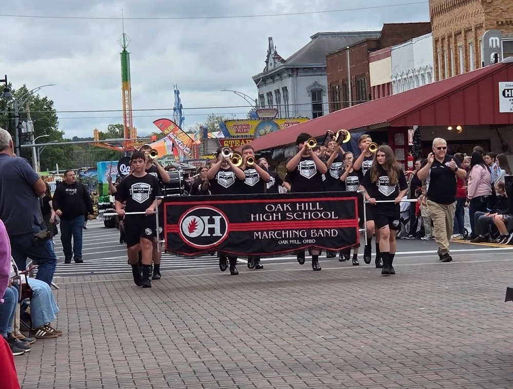 Photo of Marching Oaks band in the streets of Jackson for the Apple Festival Grand Finale Parade