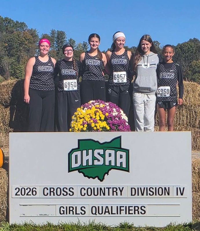 Photo of girls cross country team that has qualified for regionals